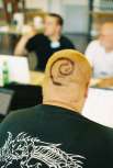 Debian fan with logo in his hair